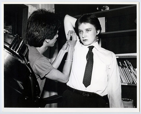 Paul Wong drawing “SS” on Jeanette Reinhardt, High Profile Slow Scan, Video Inn, Vancouver and CN Tower, Toronto, October 13, 1978, Courtesy of Paul Wong